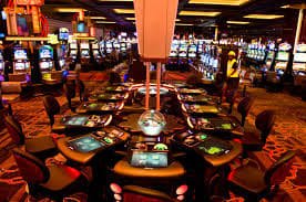Lucky Cola mobile app interface showing casino games on a smartphone screen